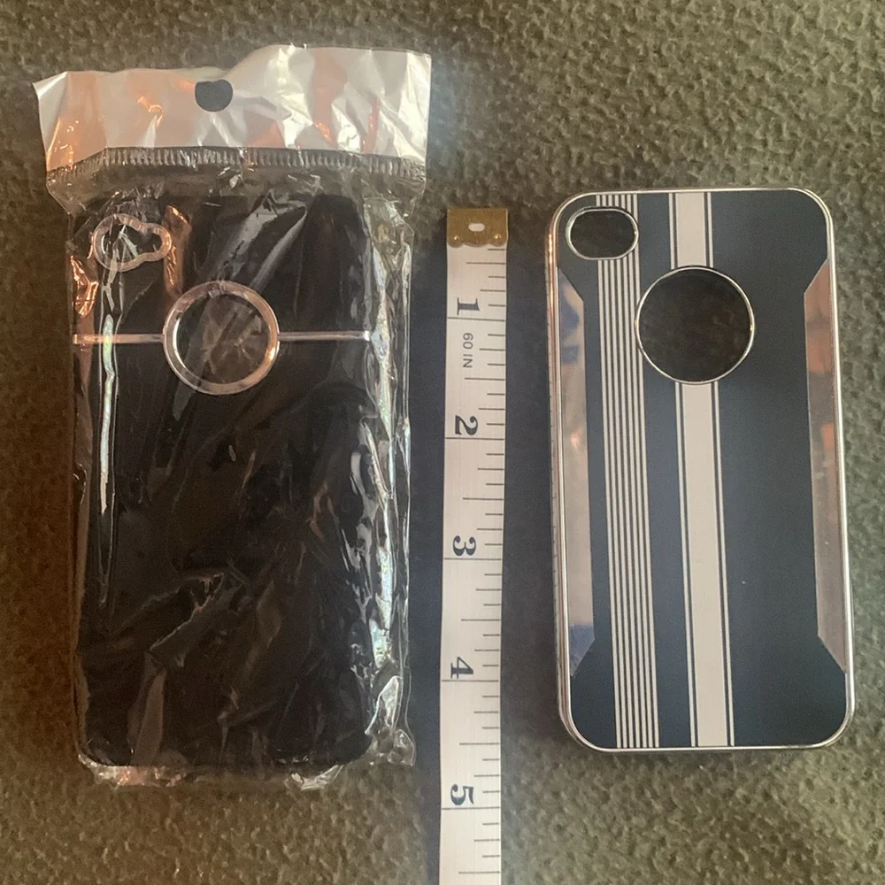 NIP black and silver phone cover and one GUC black and silver phone cover.